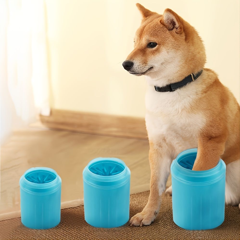 Dog beside three MudErase paw cleaner sizes